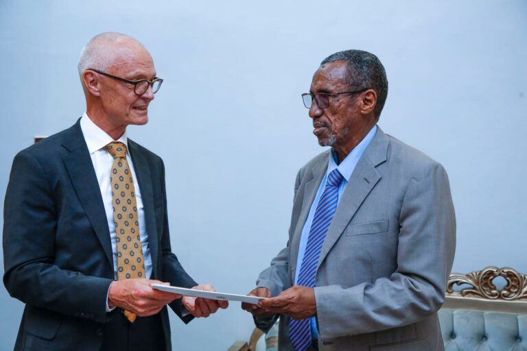 Director General of Protocol at the Ministry of Foreign Affairs of Somalia receives a copy of the…