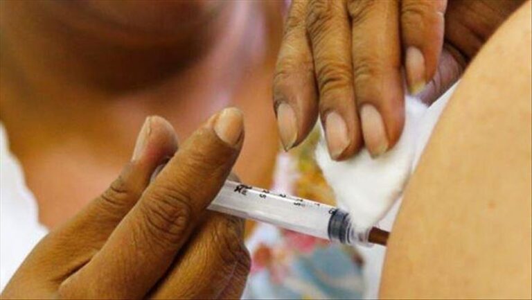 Vaccination, not travel curbs, key to battling Omicron, WHO says